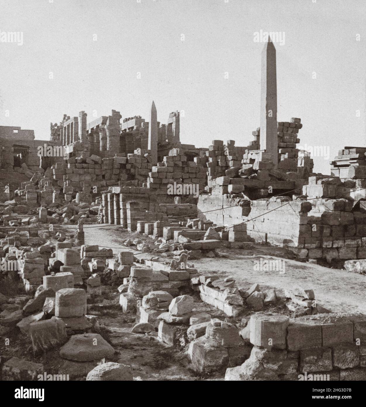 Vintage photo shows  ruins of the Temple of Karnak complex at Thebes, Egypt. 1900s Stock Photo