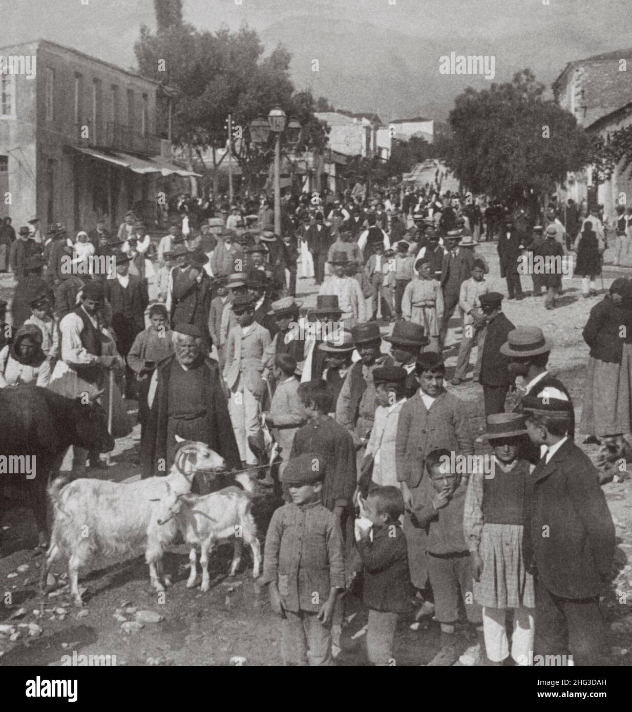 Archival photo of the 19th century Greece. In Sparta. Villagers and country men on market day. To the west through Ares Street to mountains, Greece. 1 Stock Photo