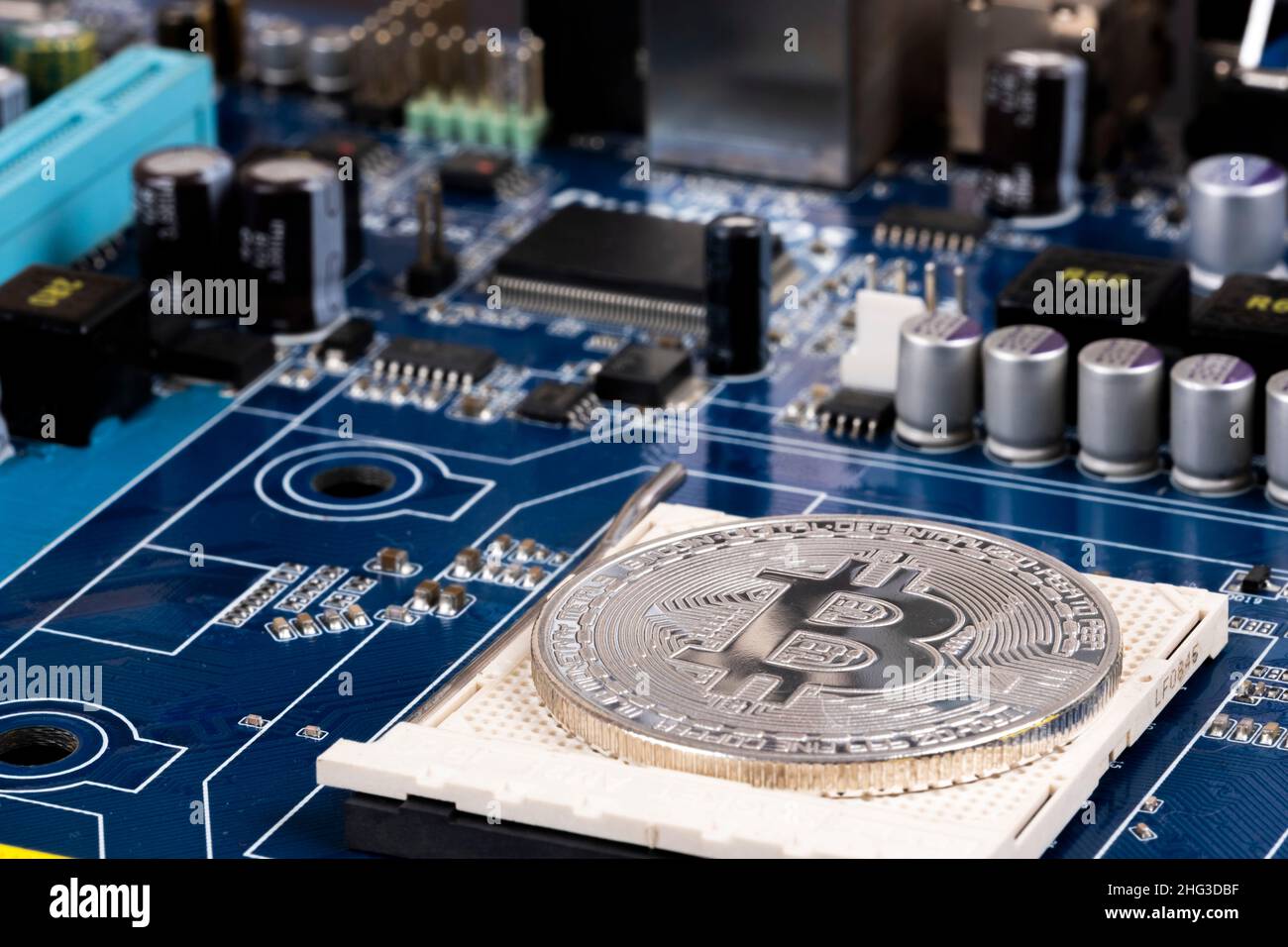 golden bitcoin and computer chip in background creative photo Stock Photo -  Alamy
