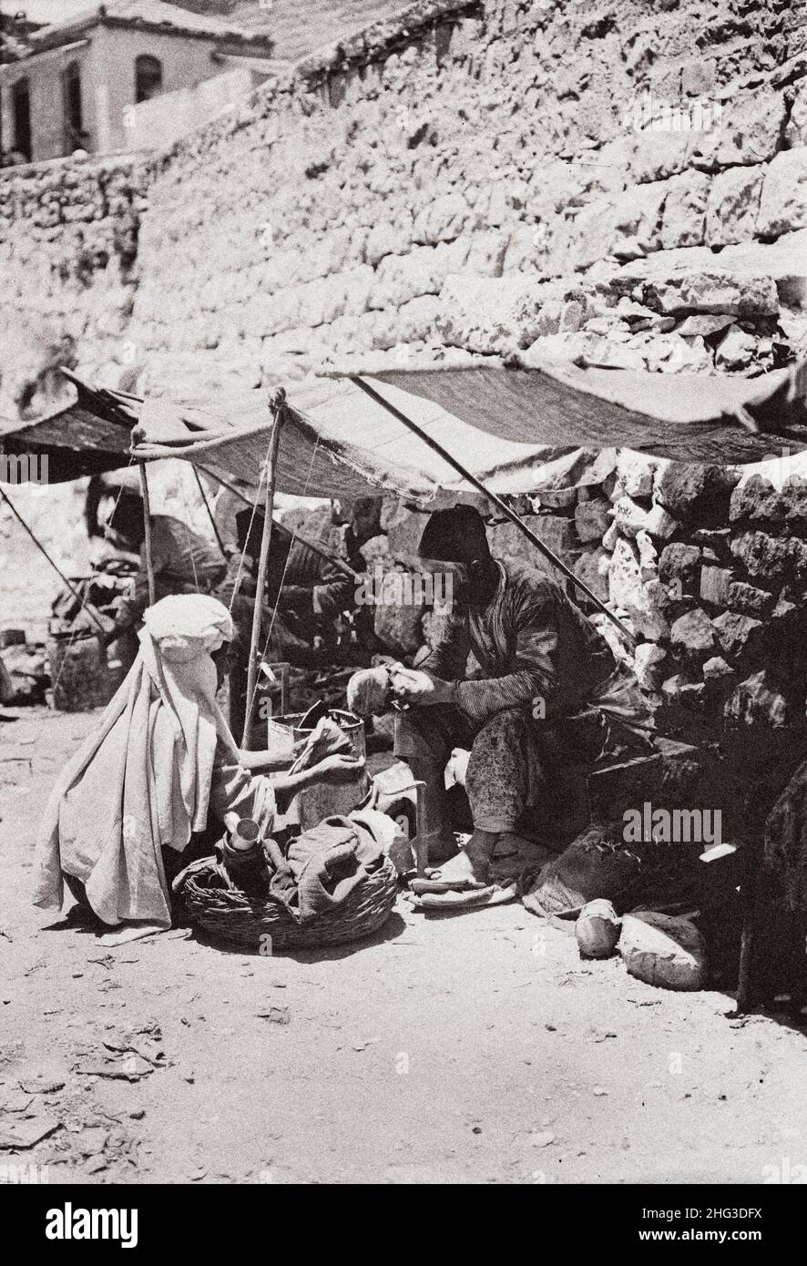 Vintage photo of various types of Palestine, etc. The shoemaker. 1910s Stock Photo