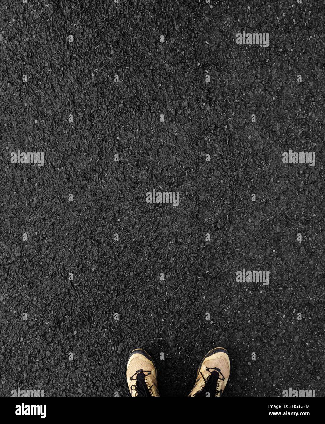 Feet of a man in boots on asphalt with space for text Stock Photo - Alamy