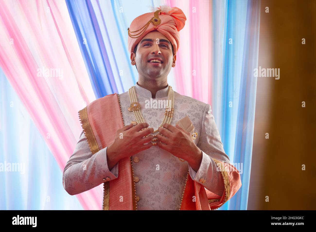 Indian groom in traditional wedding outfit Stock Photo