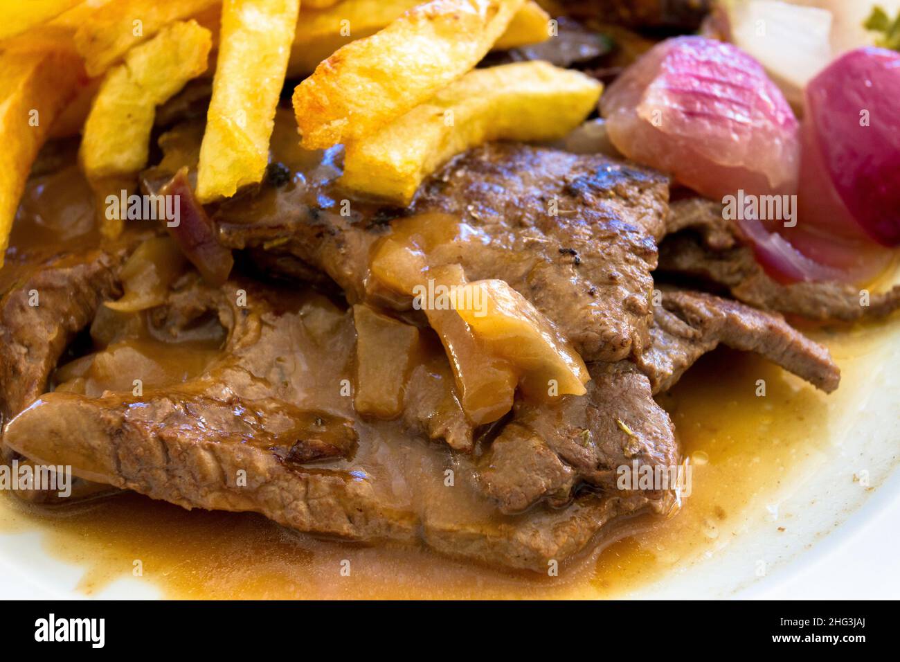veal liver on a plate with fries and onions Stock Photo Alamy