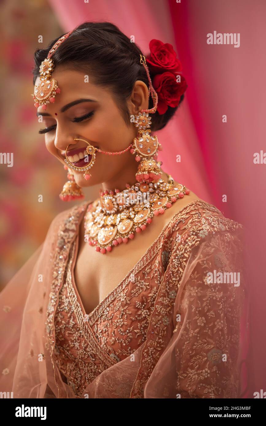 Portrait of a beautiful bride in traditional wedding outfit Stock Photo ...