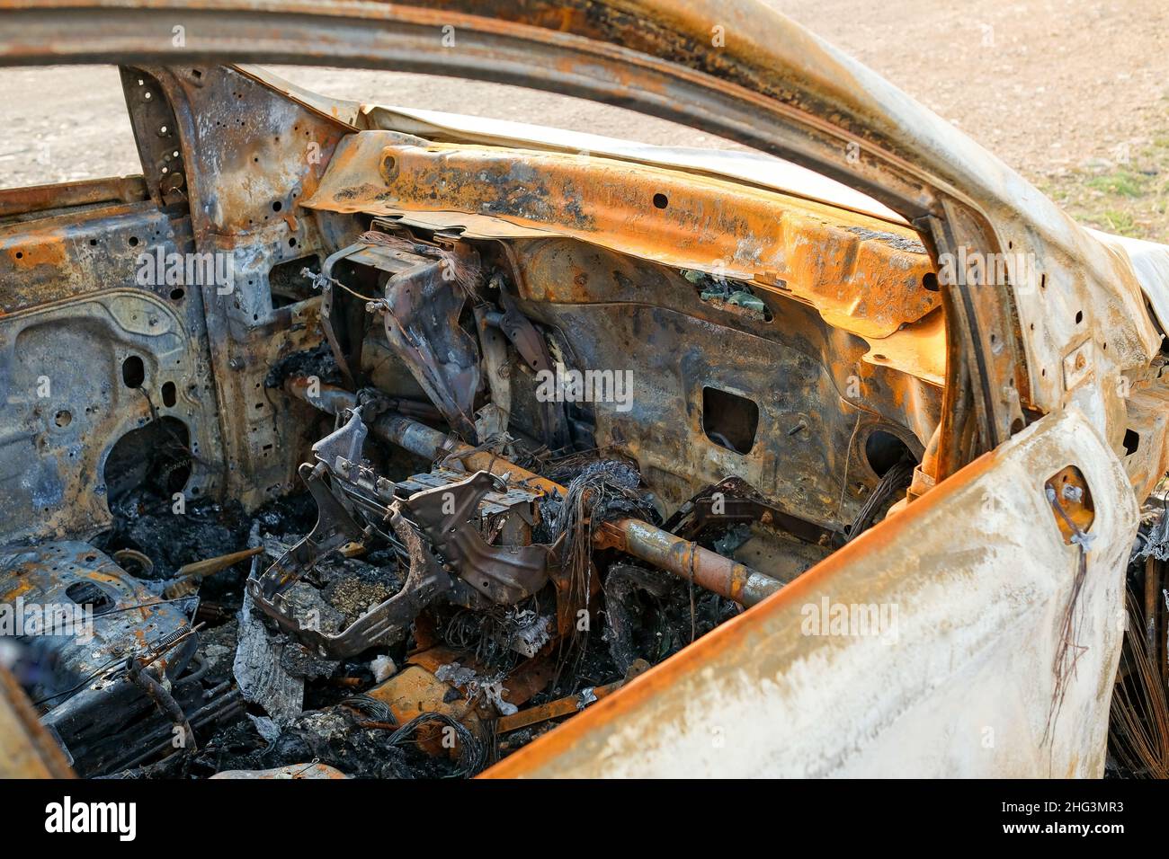 The car after the fire. Iron parts of a burnt car. Stock Photo