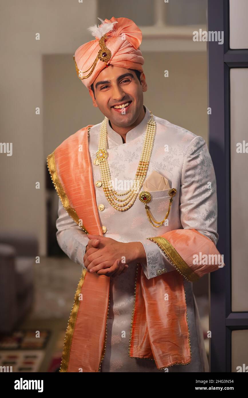 Portrait of handsome groom dressed traditional wedding clothing Stock Photo