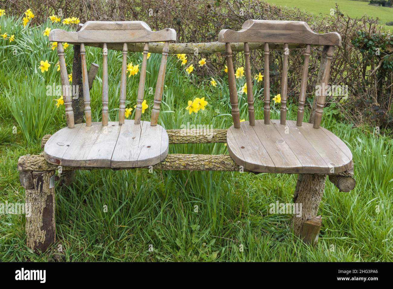 Recycled kitchen chairs now being used as a seat for walkers in the Herefordshire UK countryside,. March 2021 Stock Photo