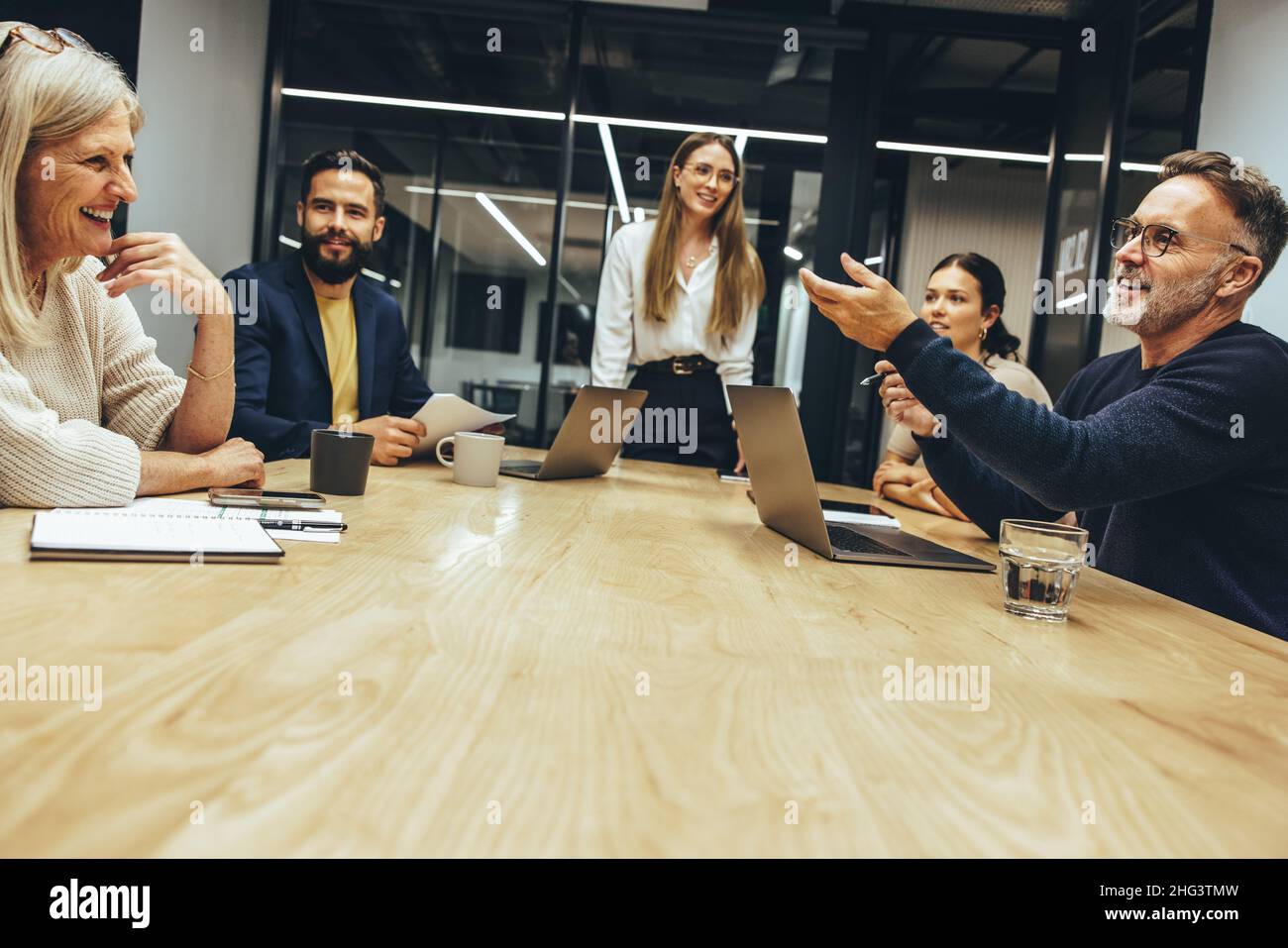 Diverse businesspeople having a meeting in a modern workplace. Team of ...