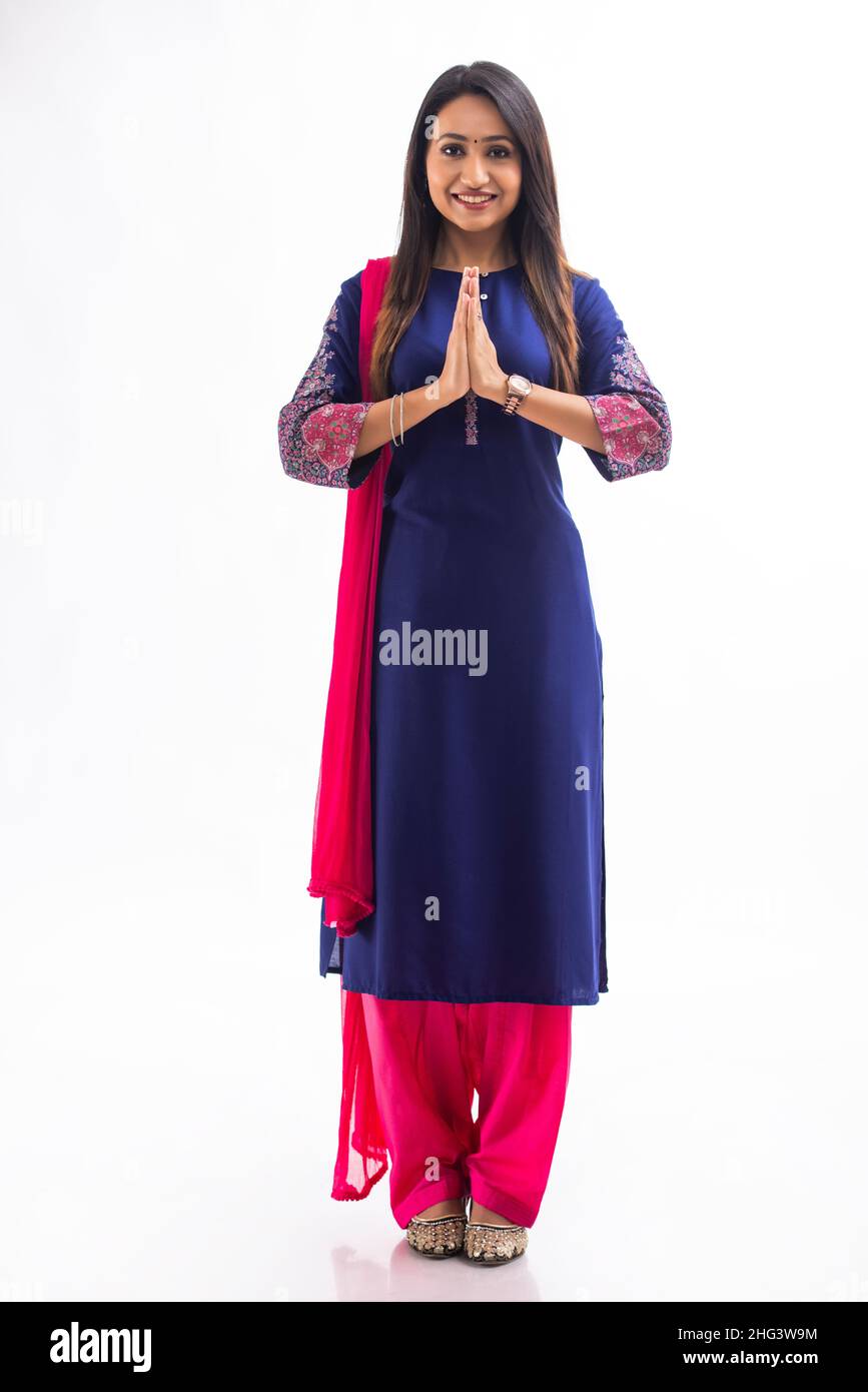 An Indian young girl in blue salwar greeting with smile Stock Photo