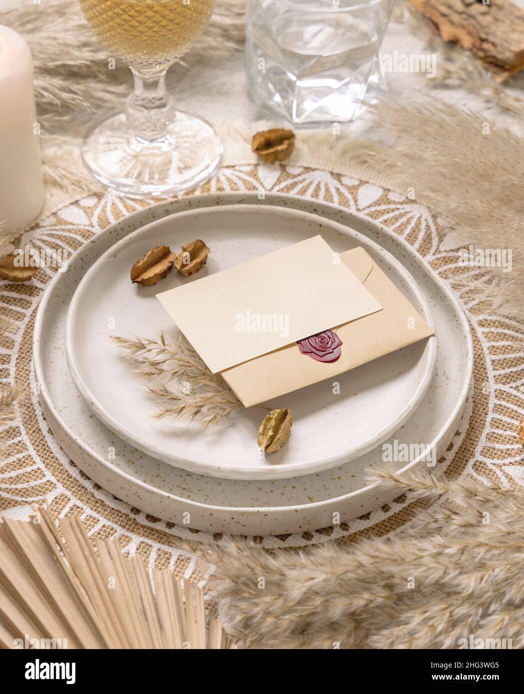 Wedding Table Place On Bohemian Placemat With Horizontal Blank Card   Wedding Table Place On Bohemian Placemat With Horizontal Blank Card Close Up Boho Wedding Card Mockup Tropical Beige Template With Dried Plants Pa 2HG3WG5 