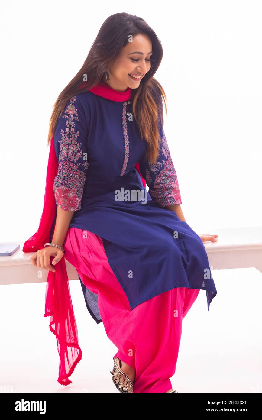 Indian girl sitting on bench hi-res stock photography and images - Alamy