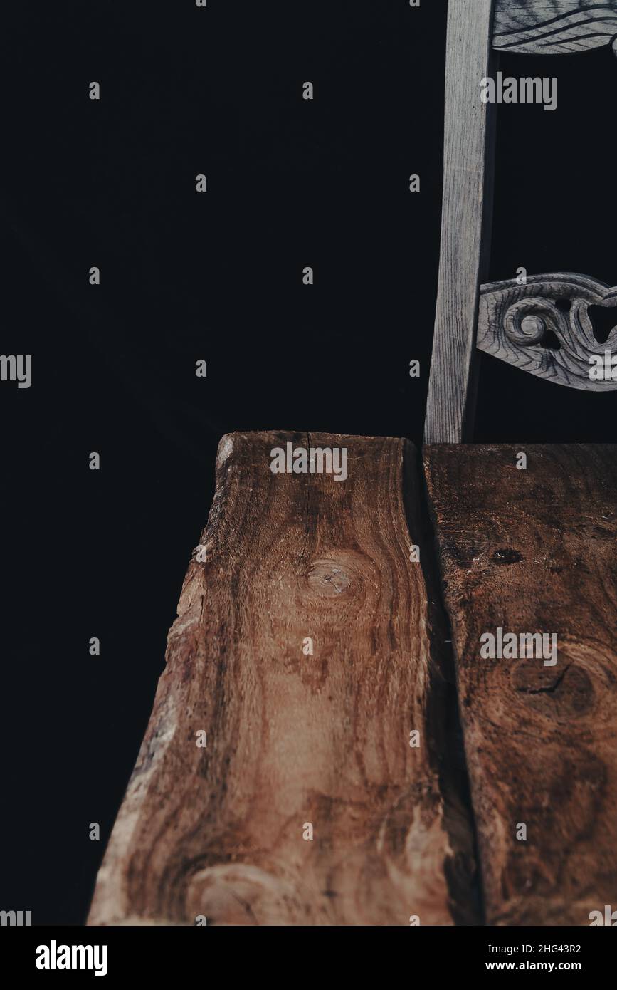 empty wooden table with smoke float up on dark background. Stock Photo