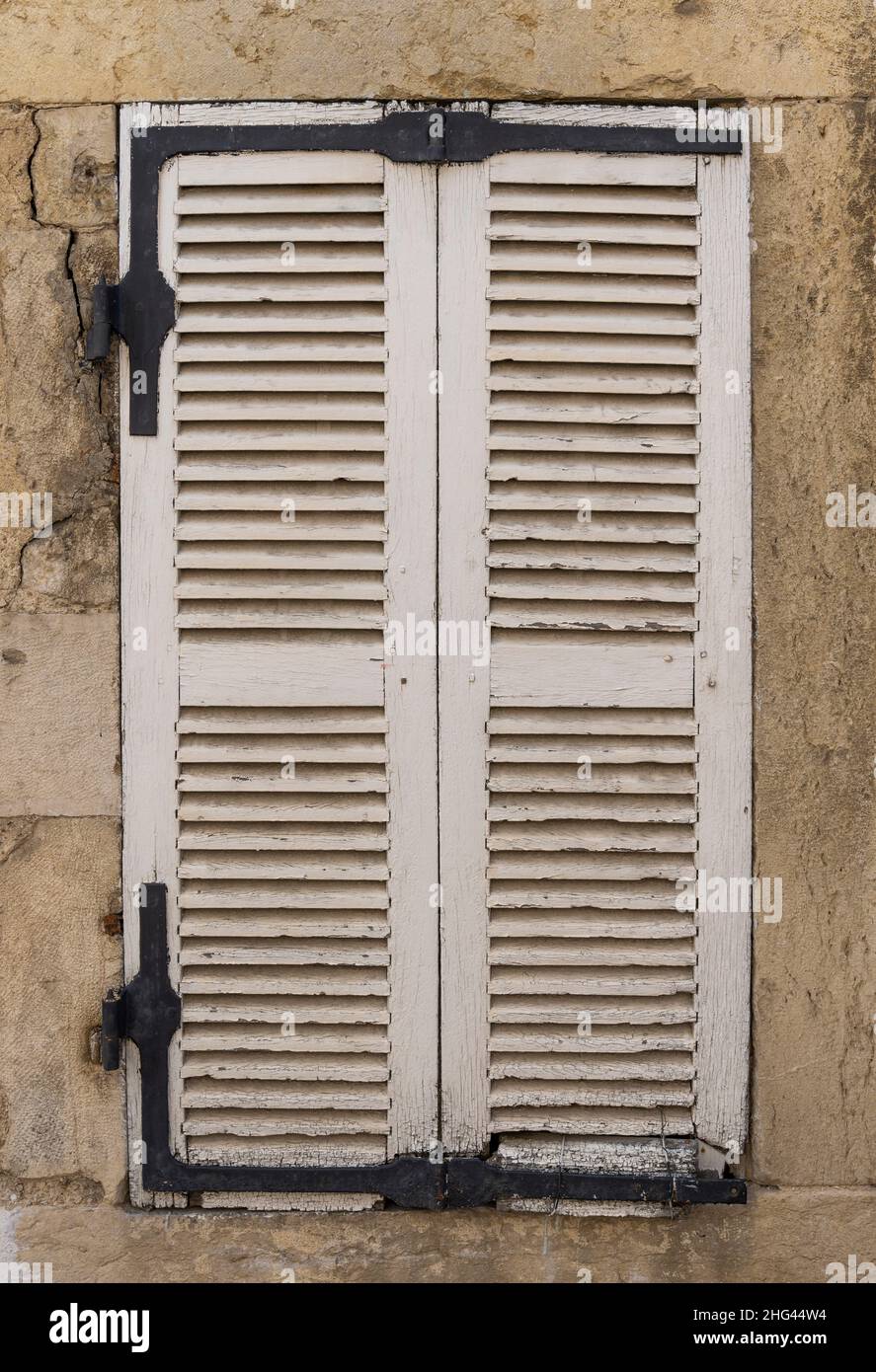 Closed white shutters in a house in France. Stock Photo