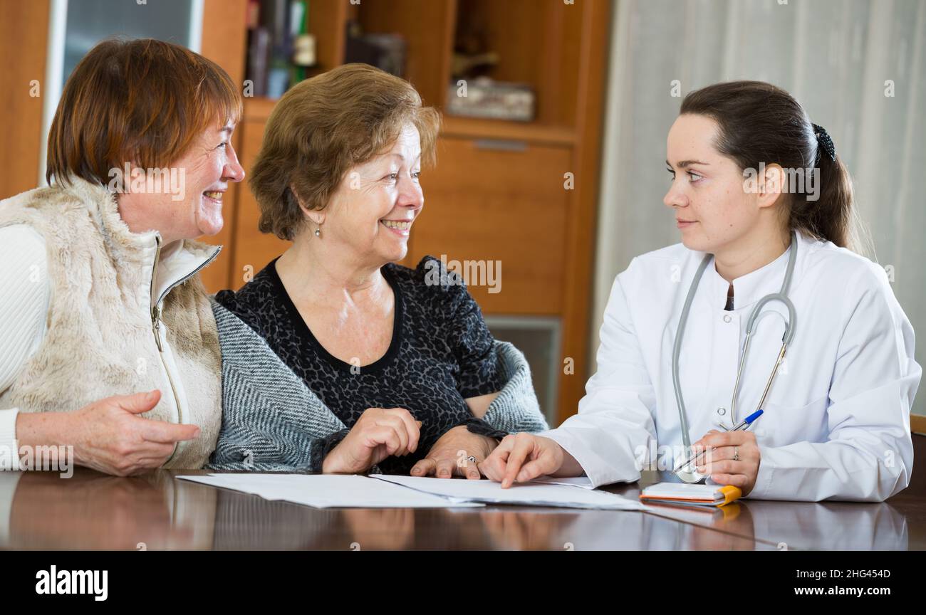 Female doctor consulting patients hi-res stock photography and images ...