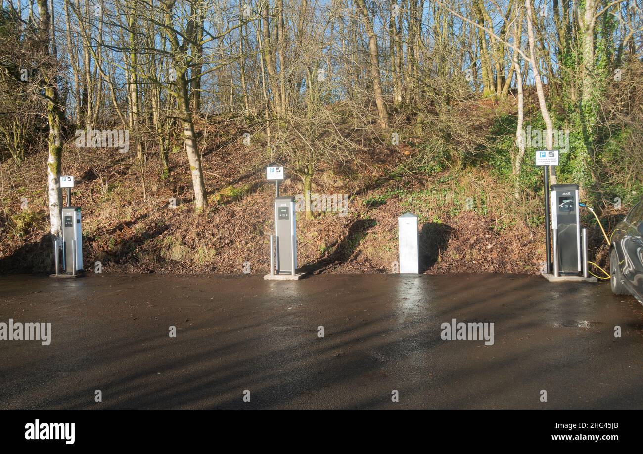 Three electric charging stations for cars in the car park of the watersports centre in Clyde Muirsheil park in Renfewshire, Scotland. Stock Photo