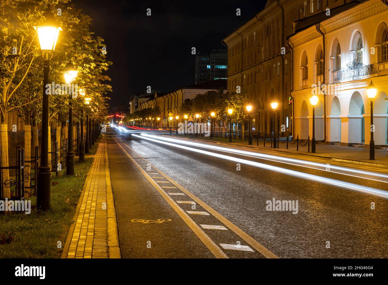 Kazan, Russia - September 21, 2019: Kremlyovskaya Street at  night with cars in the street and many laterns, Tartastan, Russia. Stock Photo