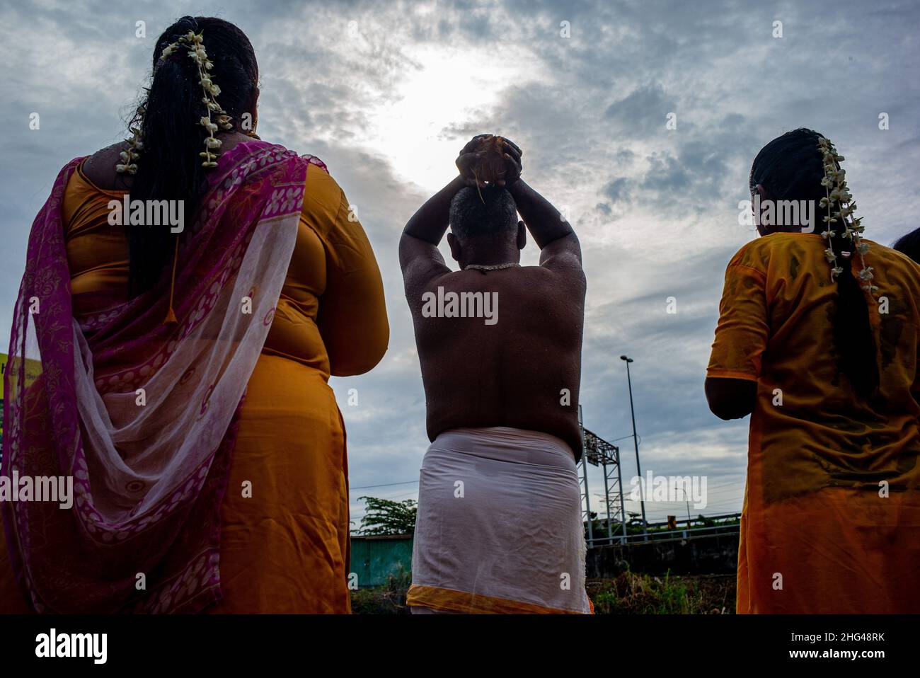 Kuala Lumpur, Malaysia. 18th Jan, 2022. Hindu devotees perform a religious ritual to celebrate the Thaipusam festival at Batu Caves on the outskirts of Kuala Lumpur, Malaysia, Jan. 18, 2022. Credit: Zhu Wei/Xinhua/Alamy Live News Stock Photo