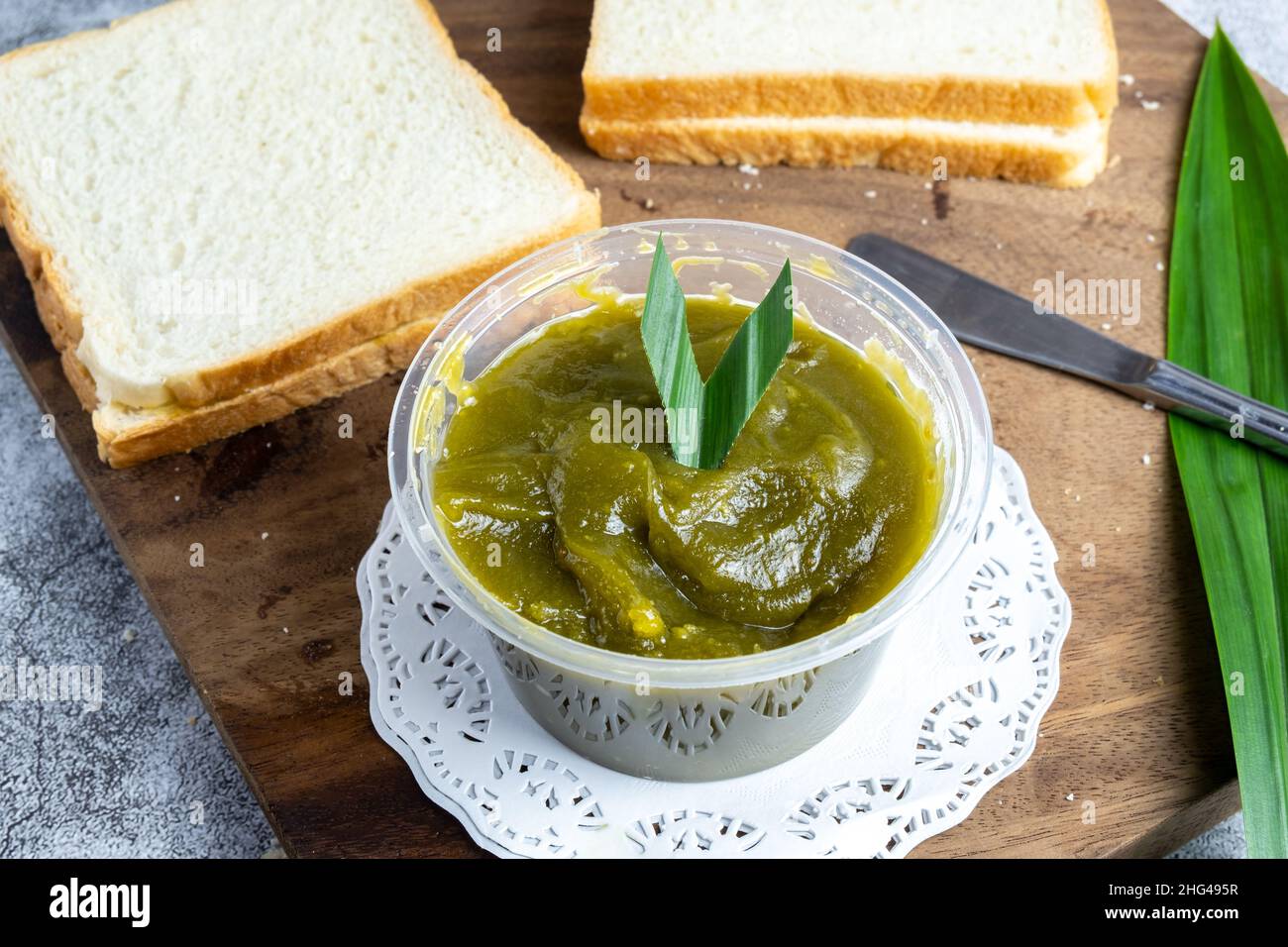 Kaya Toast, or Jam 'srikaya' , a traditional jam made from egg yolks, sugar and pandan leaf coloring. Typical of Southeast Asia, Singapore Stock Photo