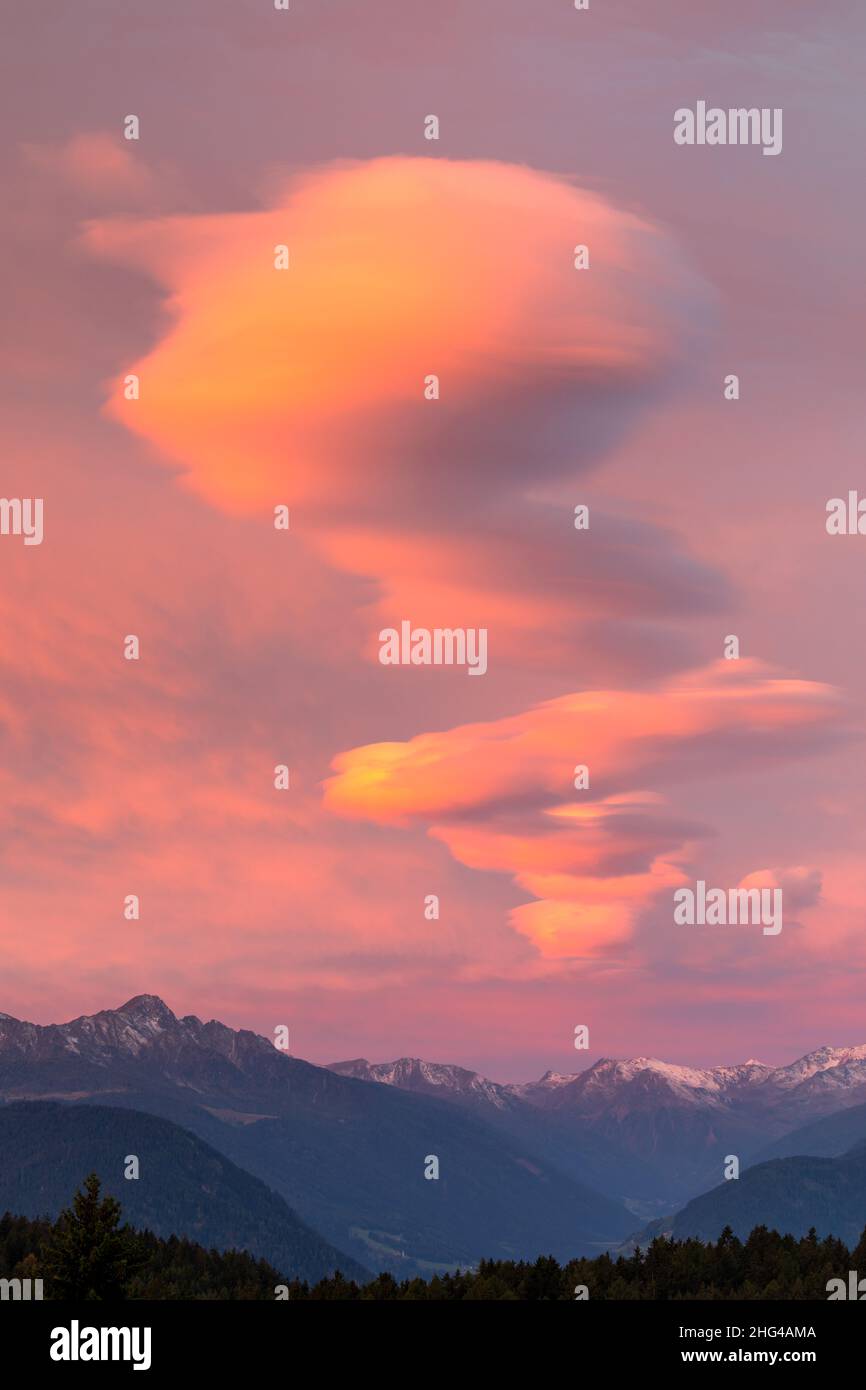 Cloud formation at sunrise above the Ortles alps, South Tyrol Stock Photo