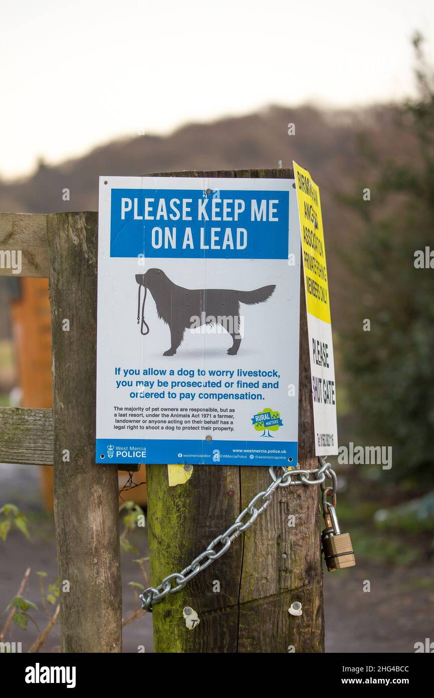 Rural police sign reminding dog owners to keep their pet dogs on a lead in the countryside and not to disturb, worry livestock. Stock Photo