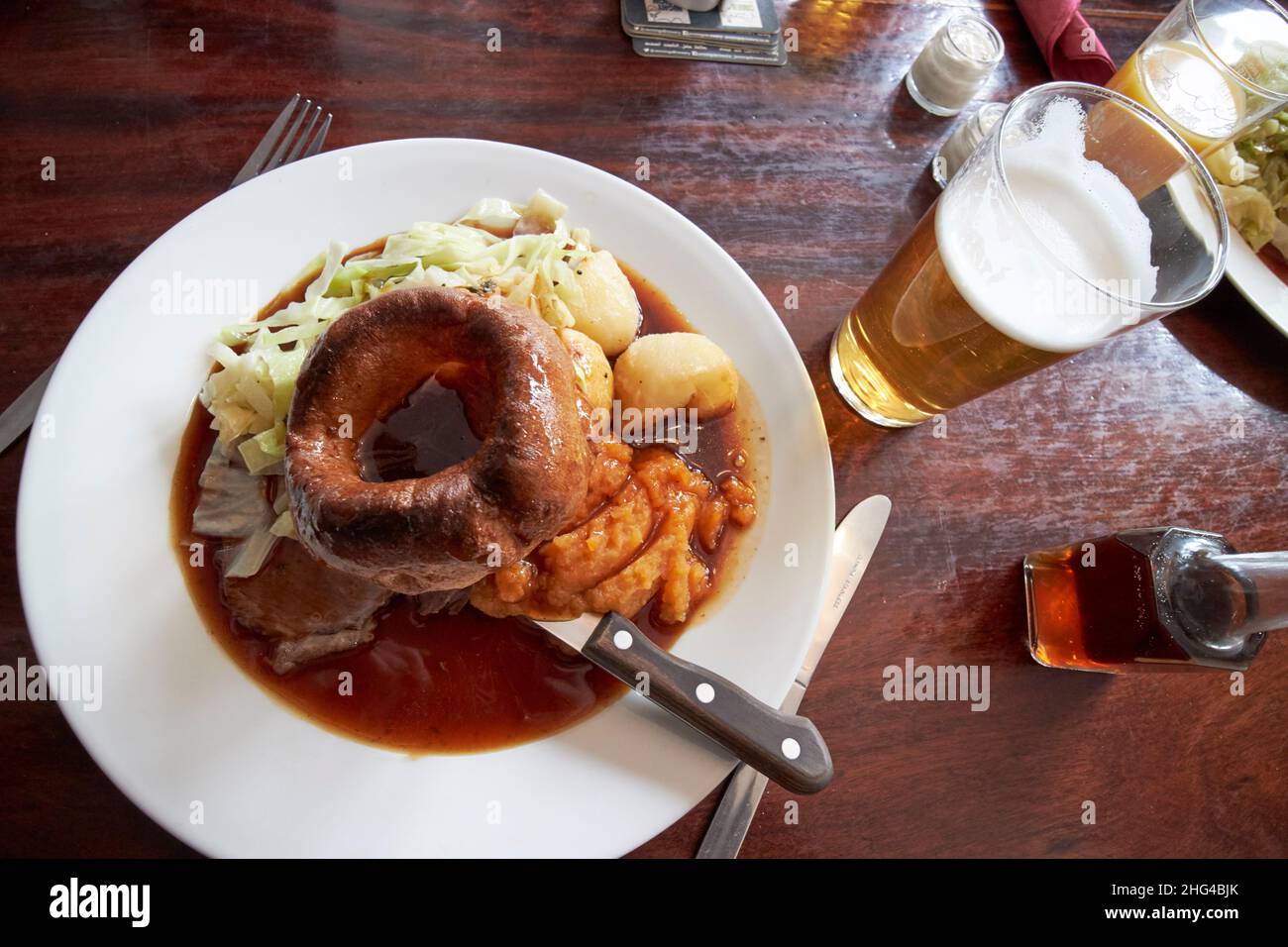 pub lunch of sunday roast beef including large yorkshire pudding, lake district, cumbria, england, uk Stock Photo
