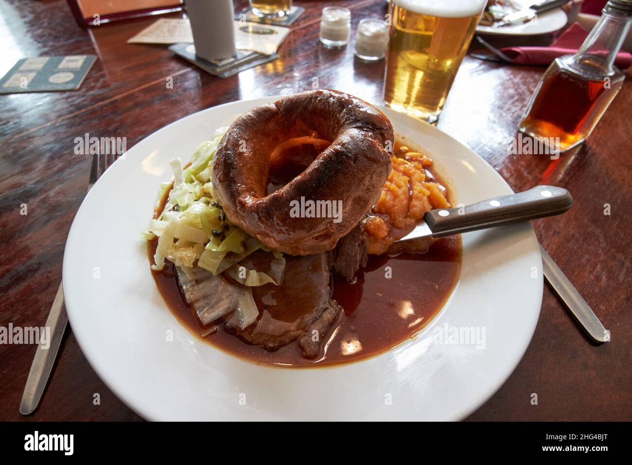 pub lunch of sunday roast beef including large yorkshire pudding, lake district, cumbria, england, uk Stock Photo