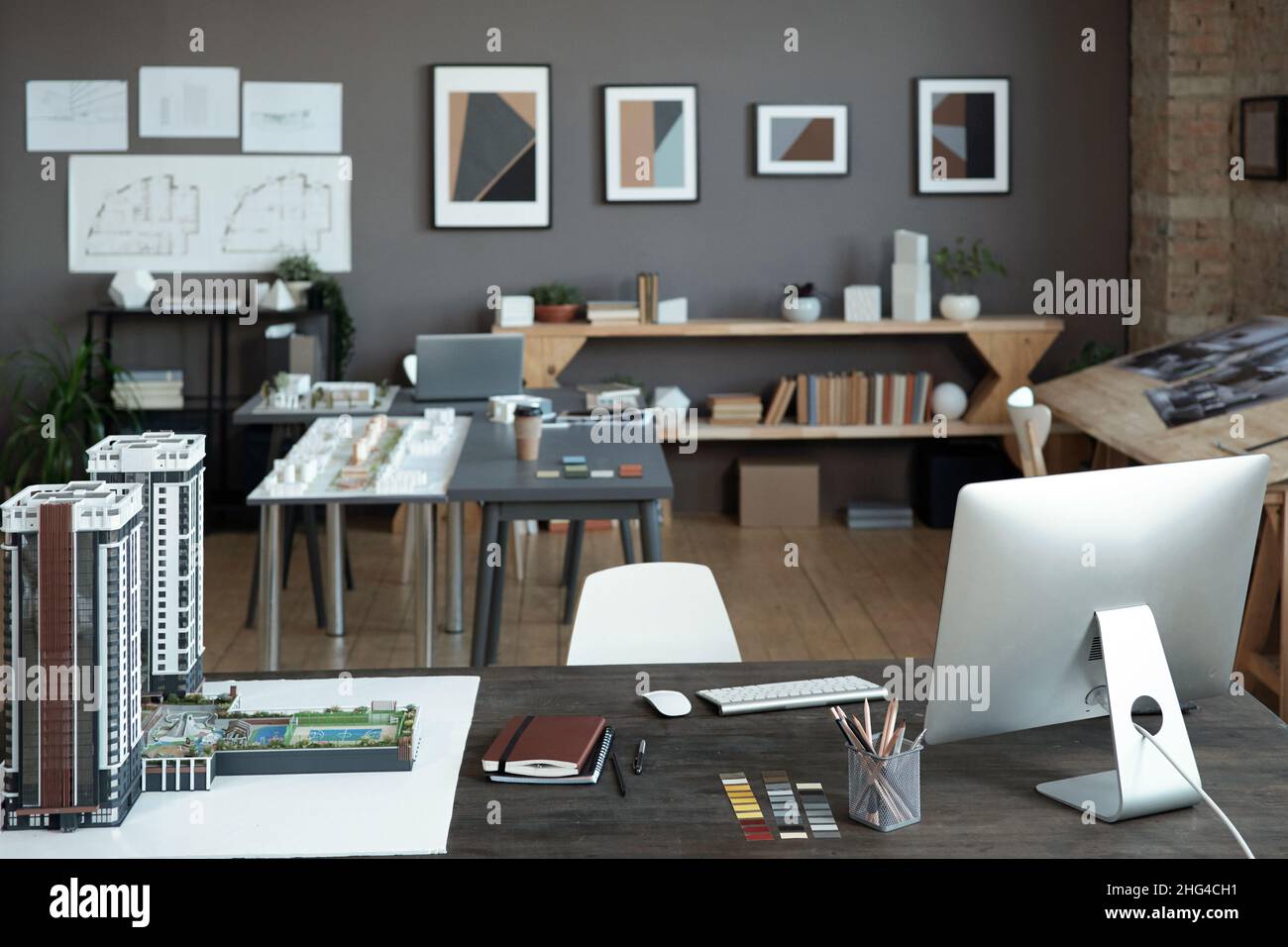 Interior of large modern office of engineers or architects with house ...