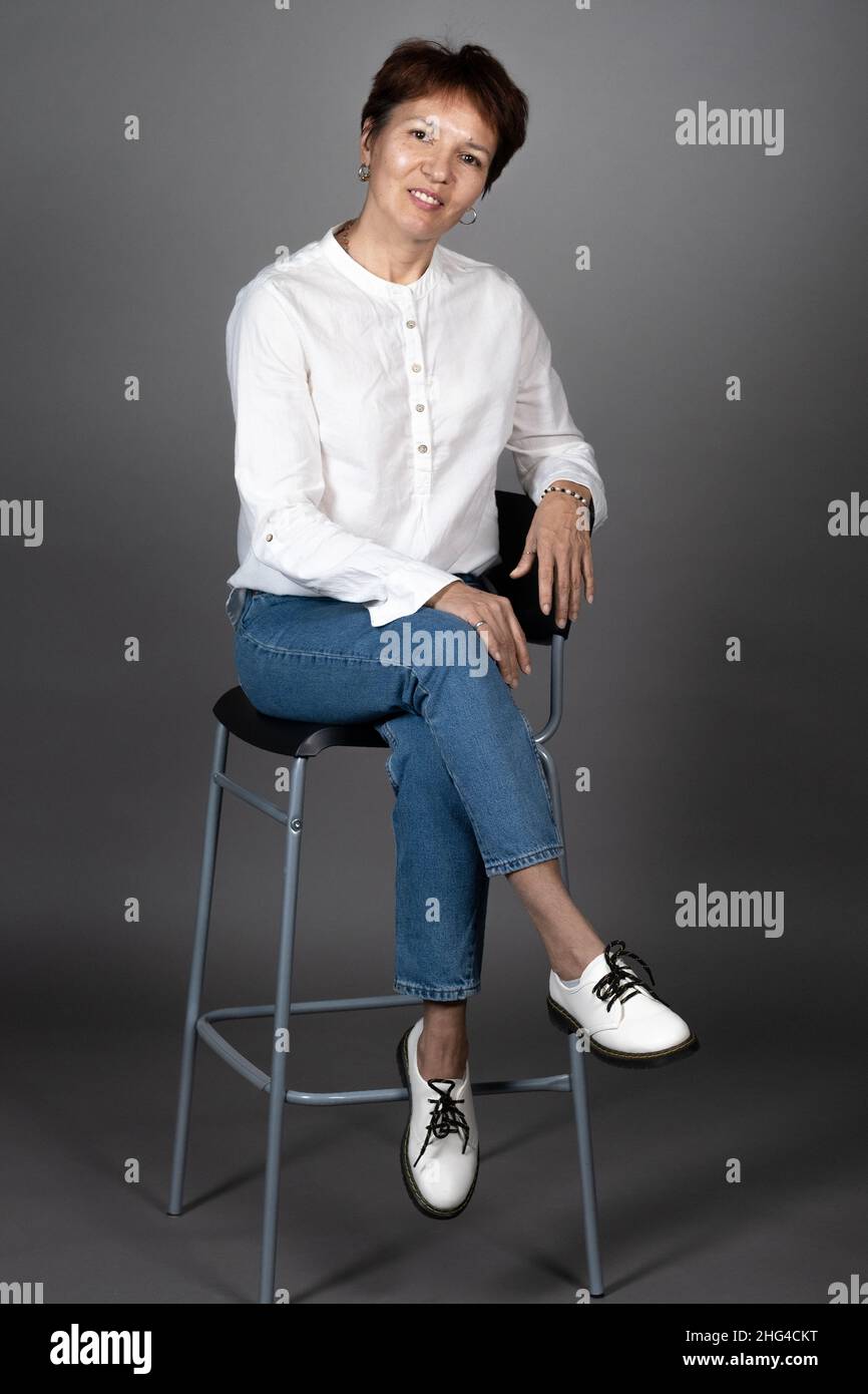 Beautiful mature woman posing in hi-res stock photography and images ...