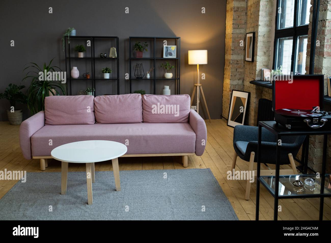 Image of modern sofa with coffee table in front of it in the living ...