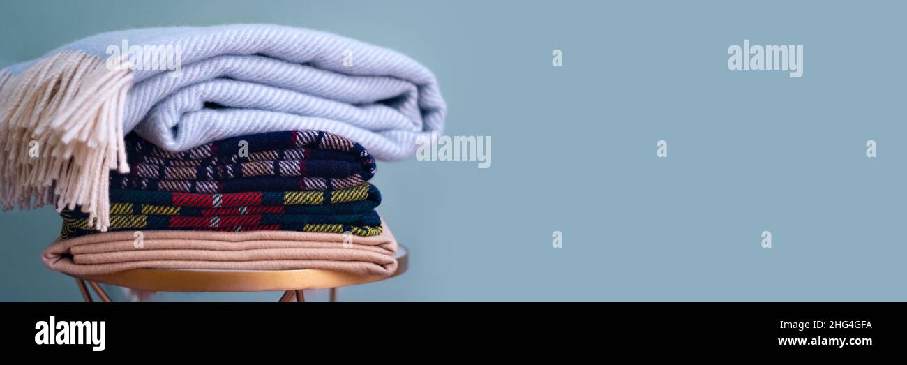 Stack of woolen checked blankets Stock Photo