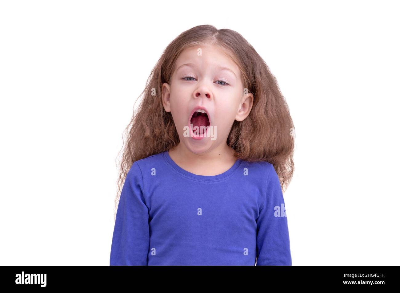 Yawning child kid gaping with open mouth wide and inhale deeply due to