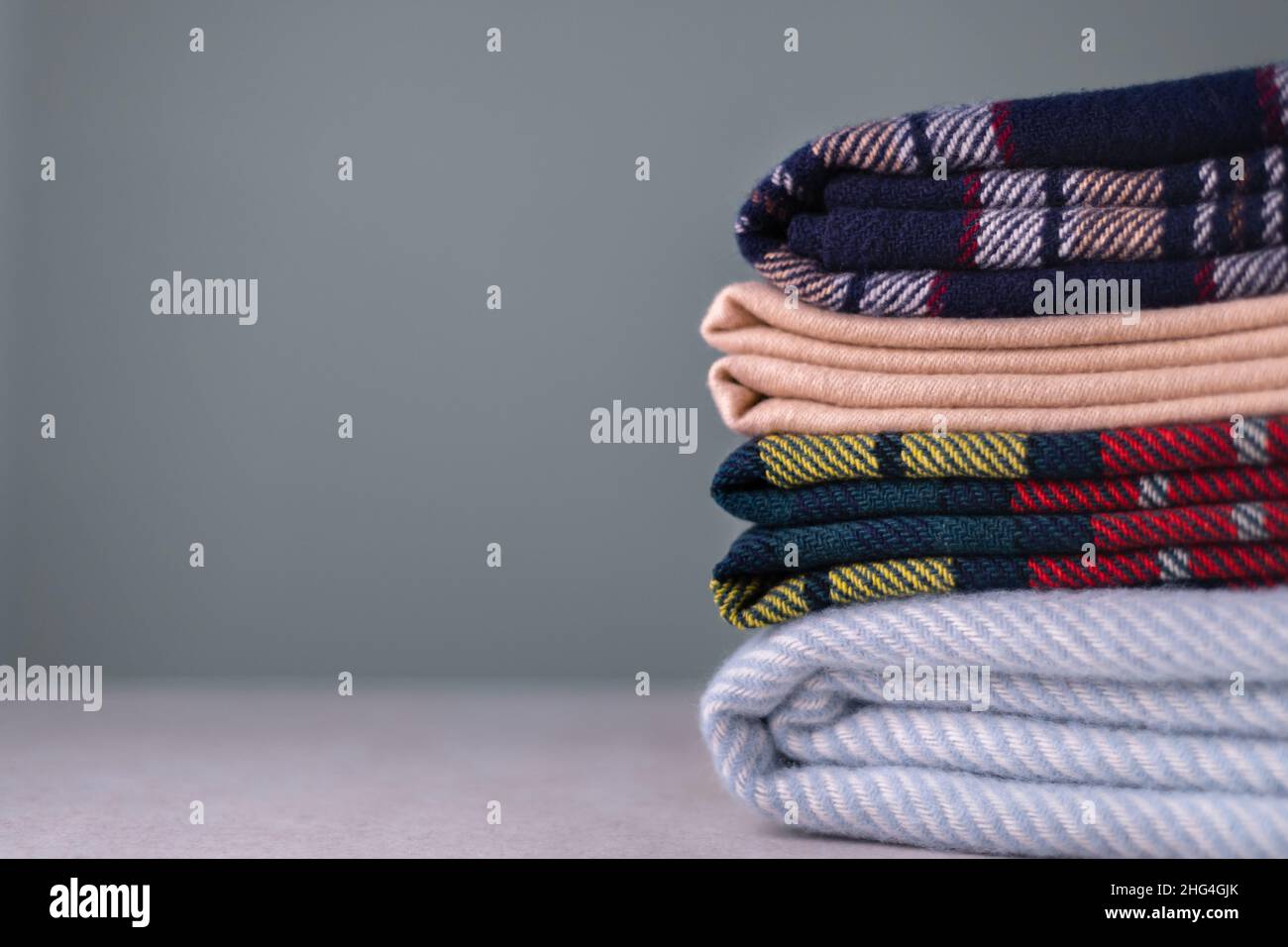 Stack of woolen checked blankets Stock Photo