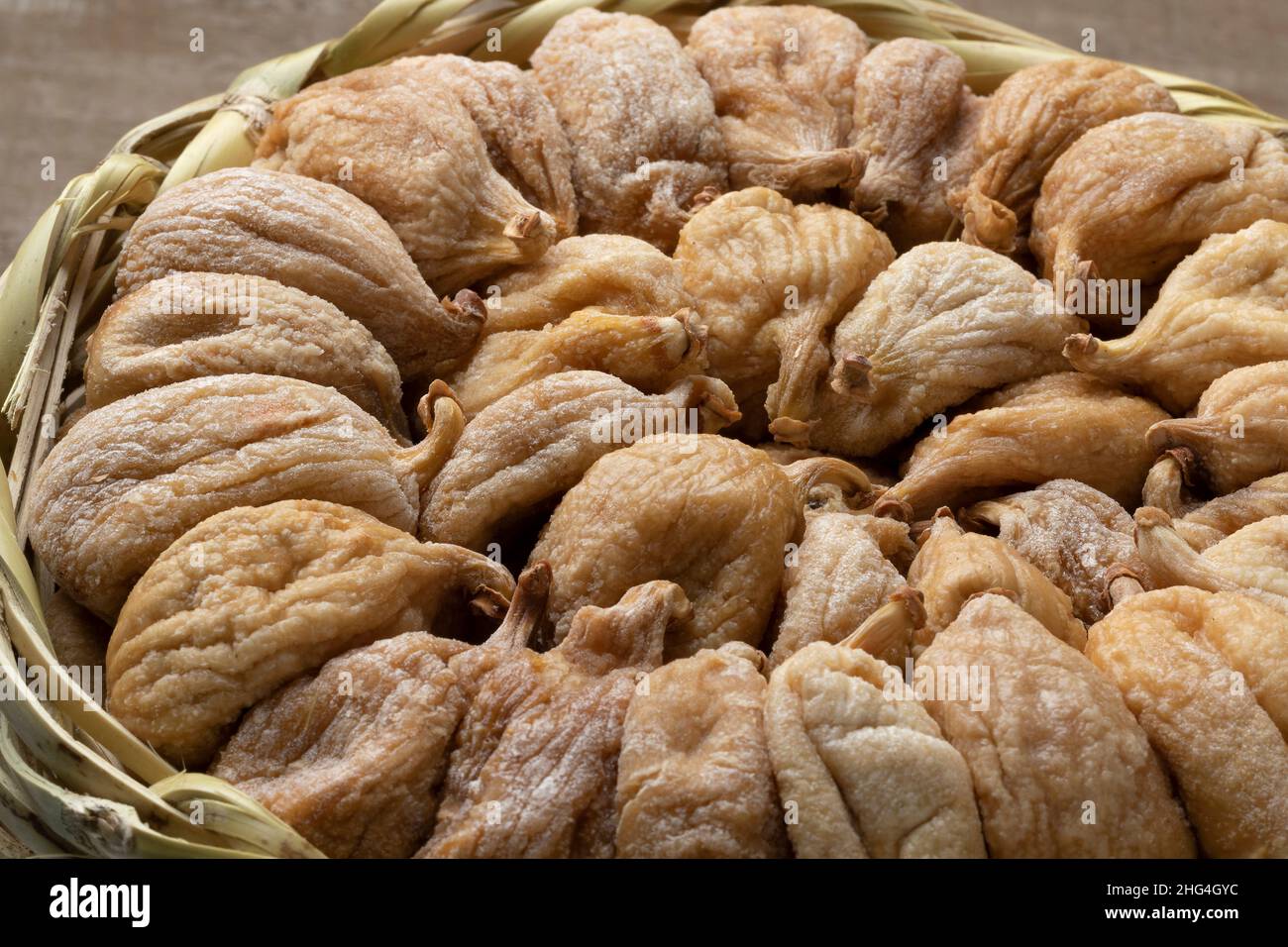Traditional dried sweet Turkish figs in a basket close up Stock Photo