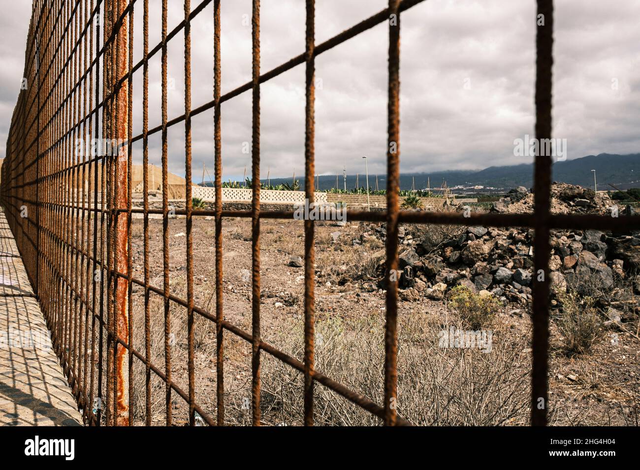 Rusty iron fence made from rebar in Playa San Juan, Tenerife, Canary Islands, Spain Stock Photo