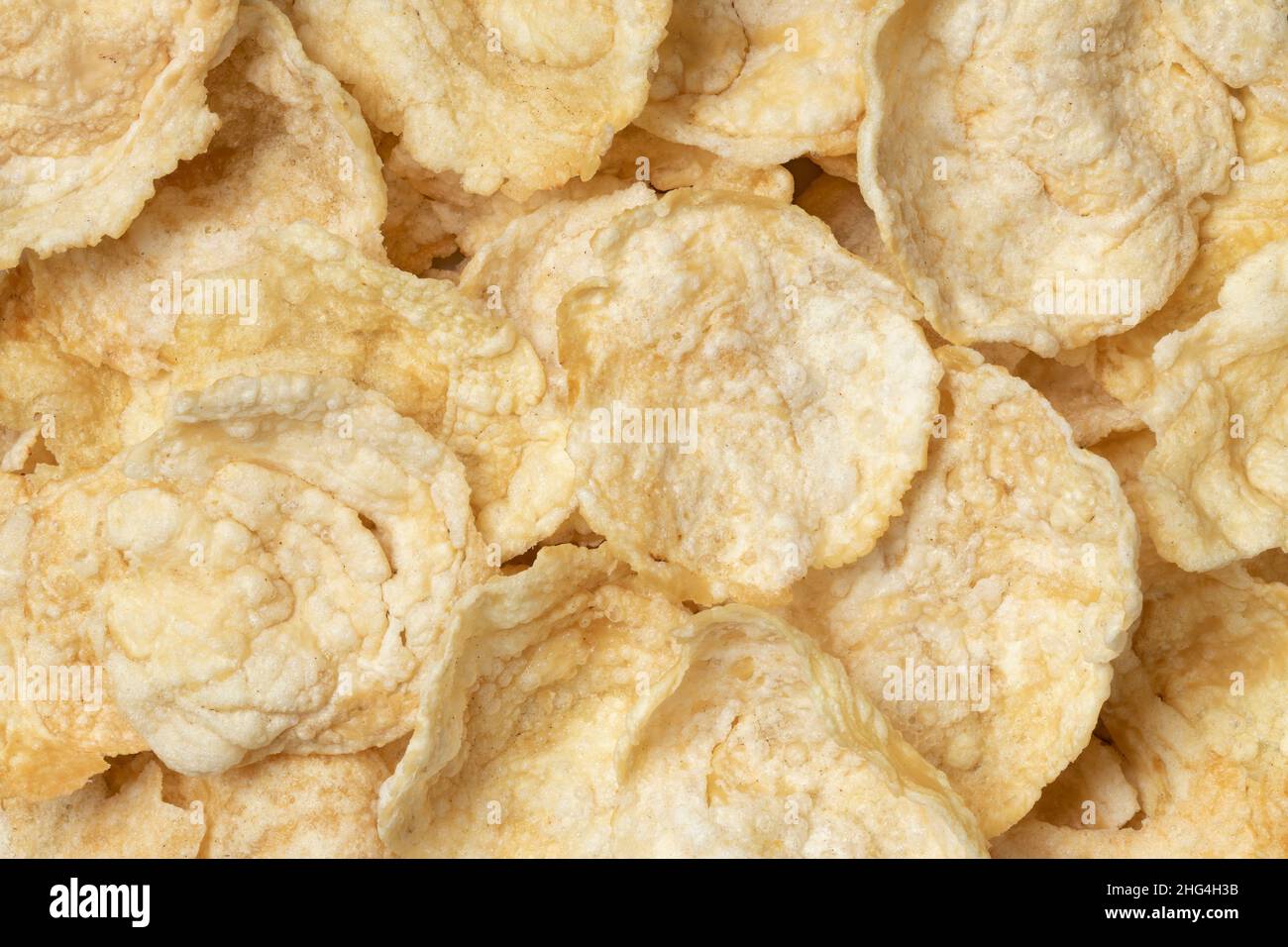 Emping, a type of Indonesian chips for a snack close up full frame as background Stock Photo