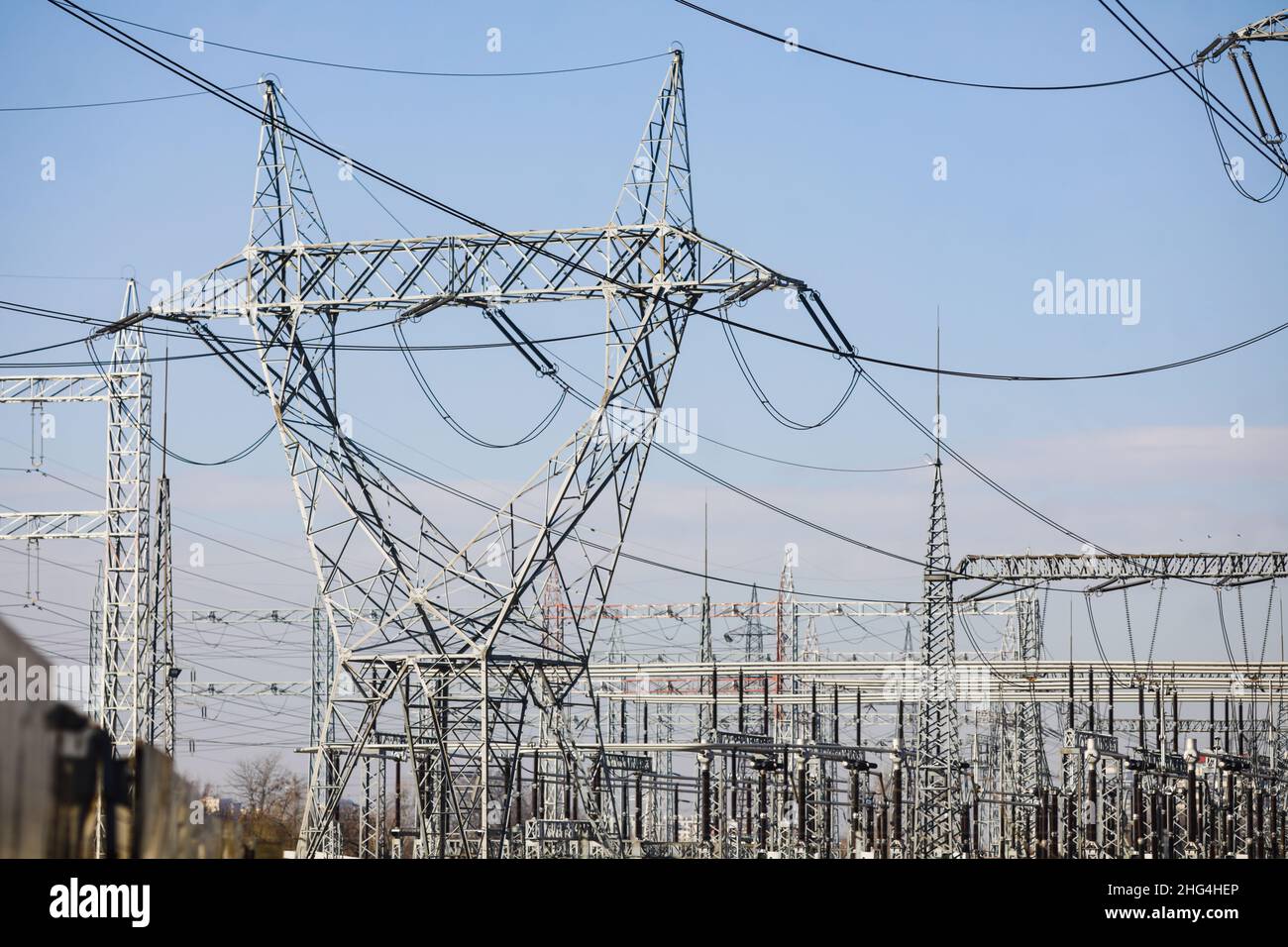 High voltage transmission lines on metallic poles in Bucharest, Romania. Stock Photo