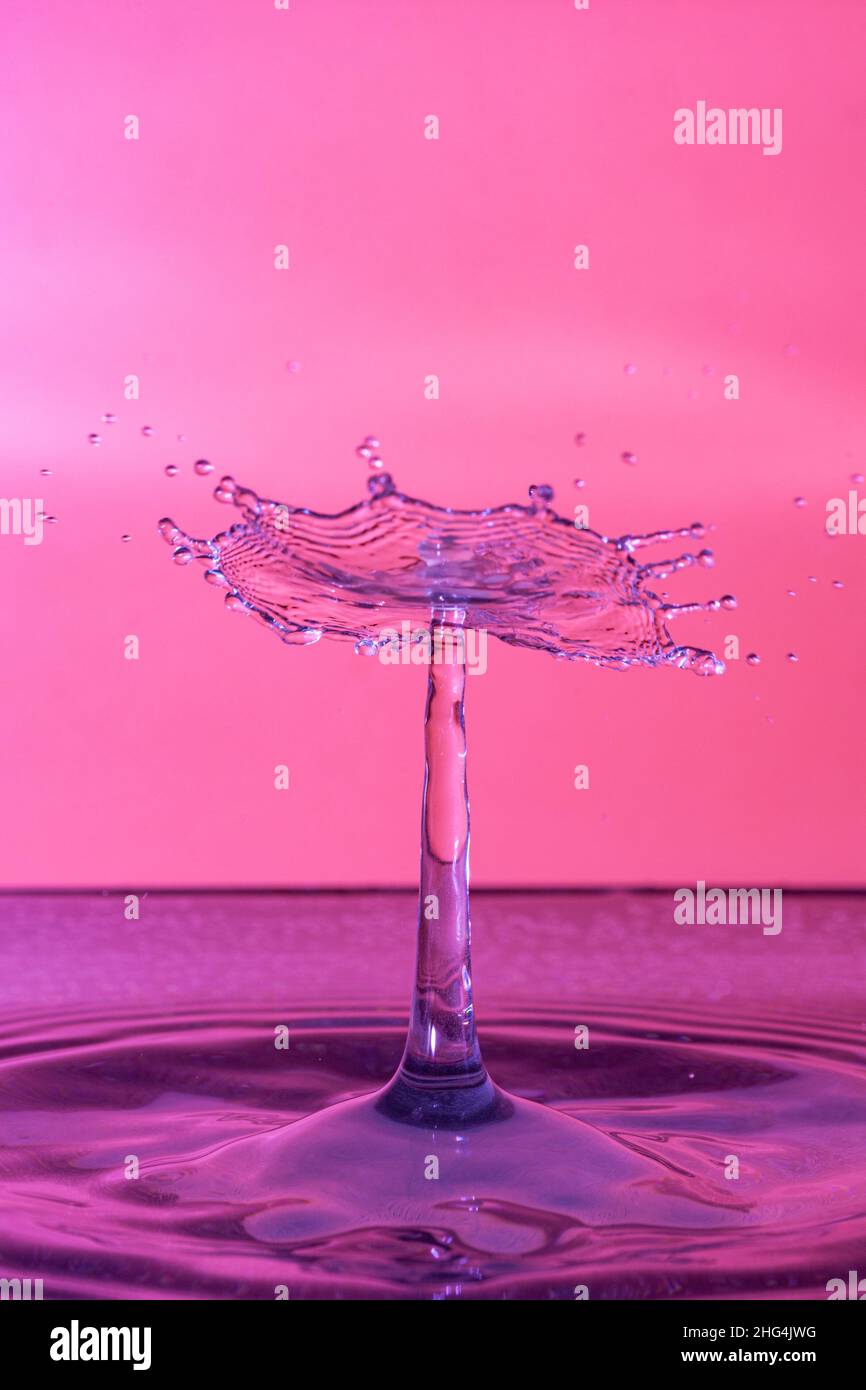 water drop splash on colorful background Stock Photo - Alamy