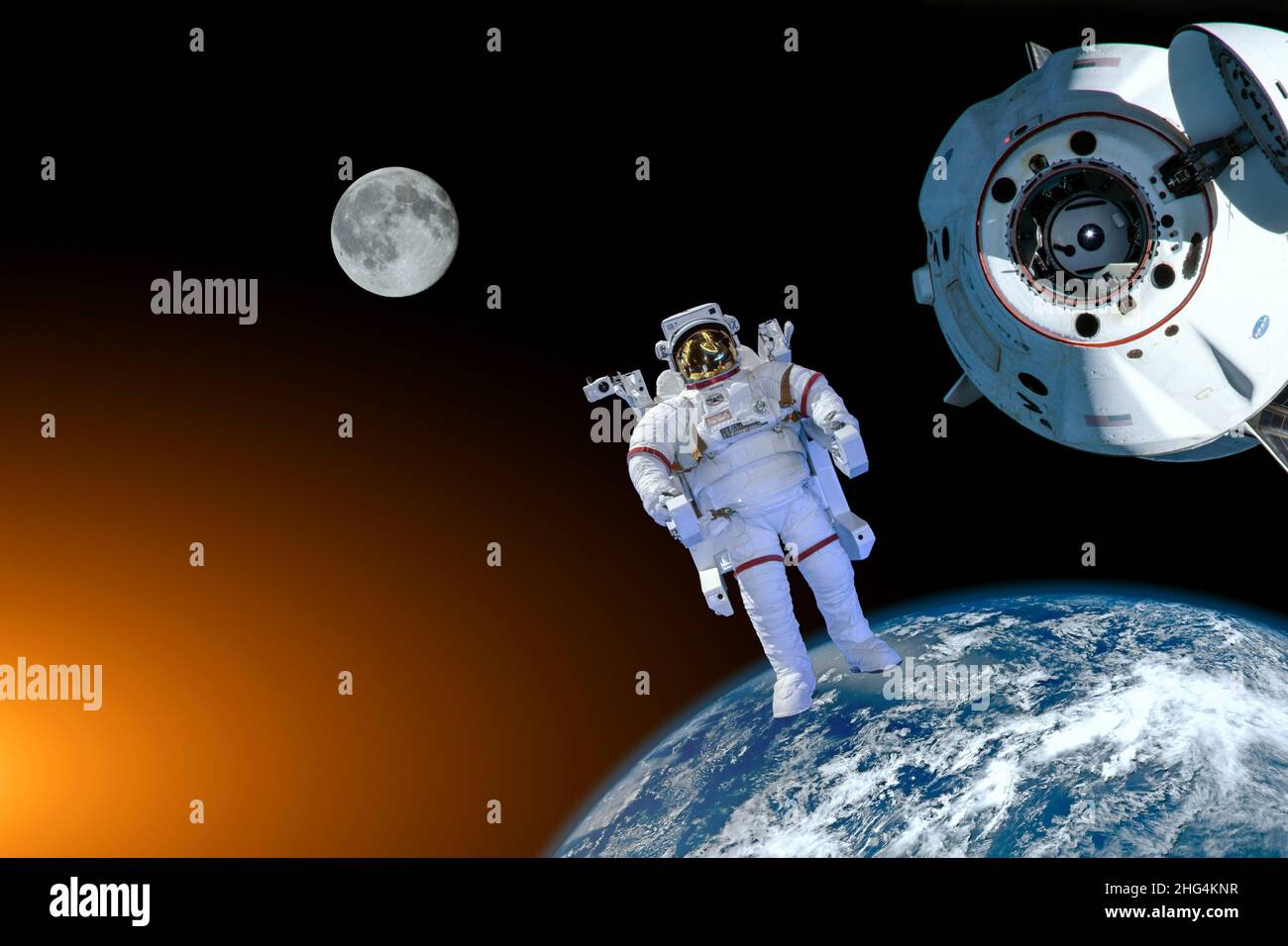 Astronaut spaceman do spacewalk while working near space station in outer space in spacesuit. Earth and Moon on background. Elements of this image furnished by NASA space astronaut photos Stock Photo