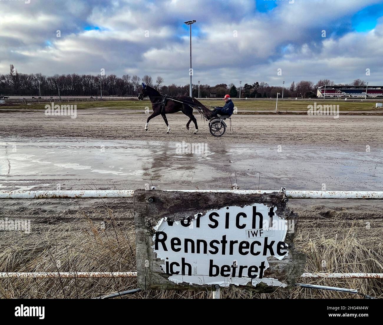 18 January 2022, Berlin: A trotter is on the move at the trotting track in Karlshorst. The area not only serves as a meeting place for horse lovers. Recreation-seekers also love the 30-hectare area for relaxing walks. The future of the trotting track is currently unclear. In 2020, an urban development concept for the future development of the site was presented. According to this concept, harness racing and equestrian sports are to be secured at the site and an additional sports area is to be created within the grounds. Multi-story residential buildings and 44,000 square meters of commercial s Stock Photo