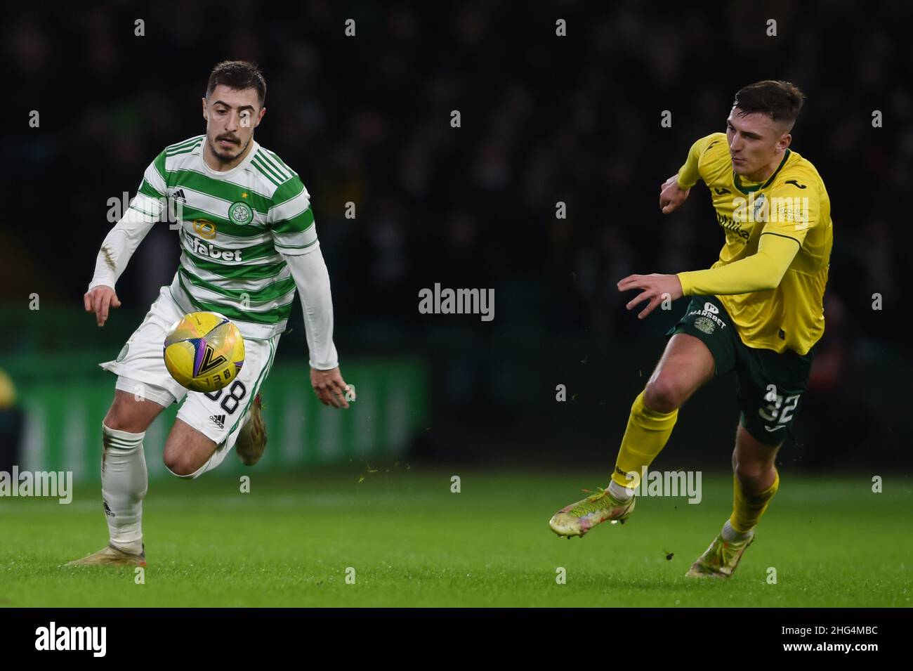 Glasgow, Scotland, 17th January 2022.  Josip Juranovic of Celtic and Josh Campbell of Hibernian during the Scottish Premier League match at Celtic Park, Glasgow. Picture credit should read: Neil Hanna / Sportimage Stock Photo