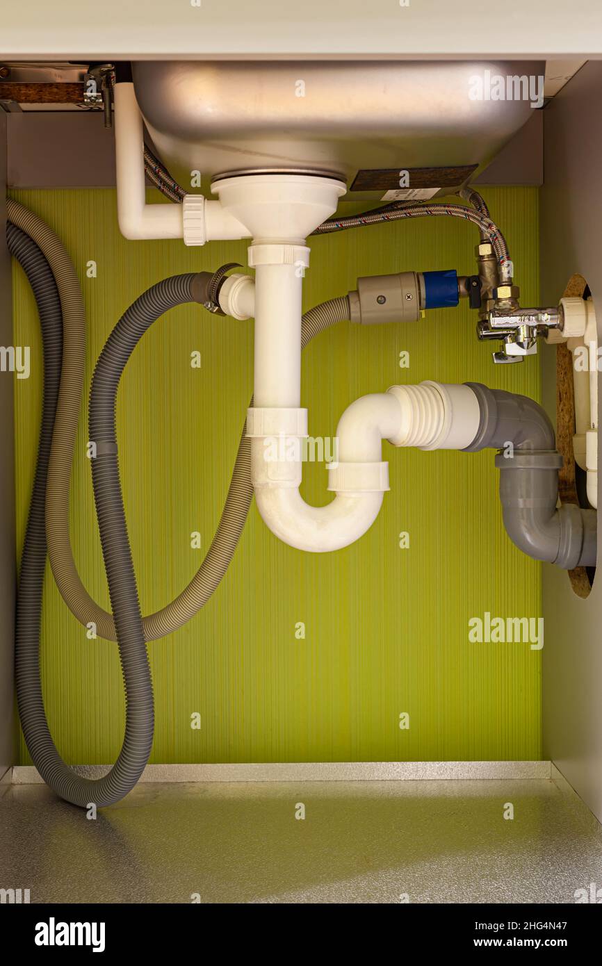drain pipes under the sink in the kitchen High quality photo