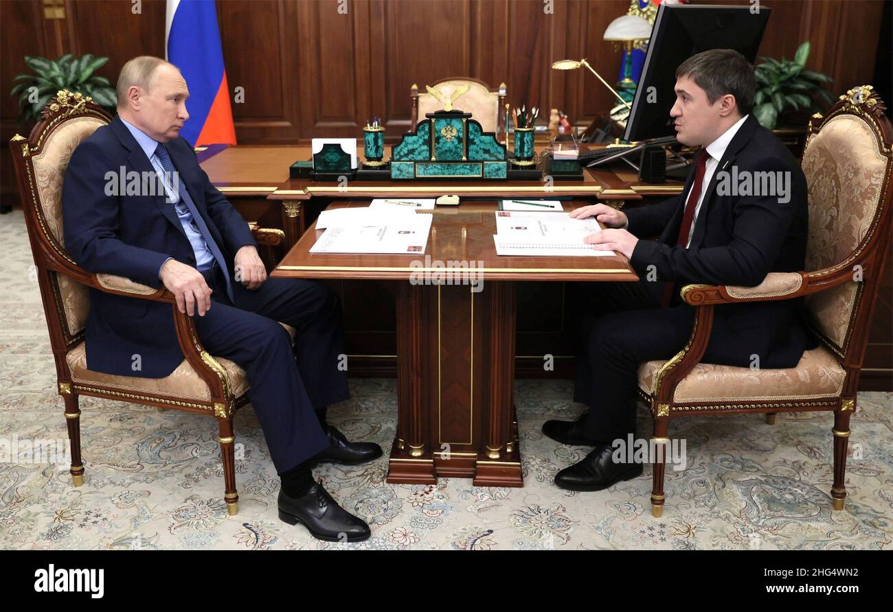 Moscow, Russia. 14 January, 2022. Russian President Vladimir Putin holds a face-to-face meeting with Governor of Perm Territory Dmitry Makhonin, right, at the his Kremlin office, January 14, 2022 in Moscow, Russia. Credit: Mikhail Metzel/Kremlin Pool/Alamy Live News Stock Photo