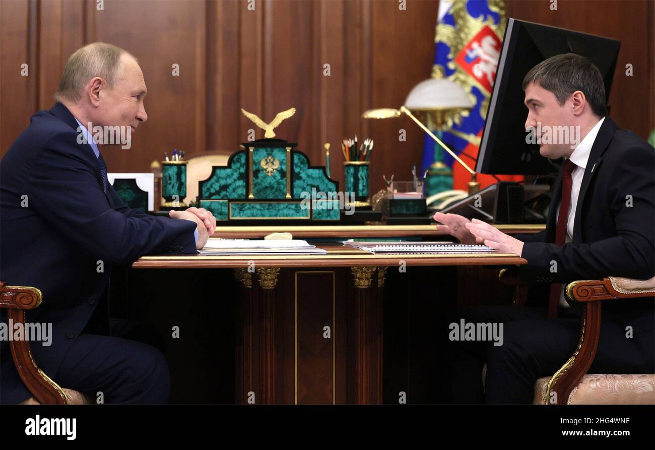 Moscow, Russia. 14 January, 2022. Russian President Vladimir Putin holds a face-to-face meeting with Governor of Perm Territory Dmitry Makhonin, right, at the his Kremlin office, January 14, 2022 in Moscow, Russia. Credit: Mikhail Metzel/Kremlin Pool/Alamy Live News Stock Photo