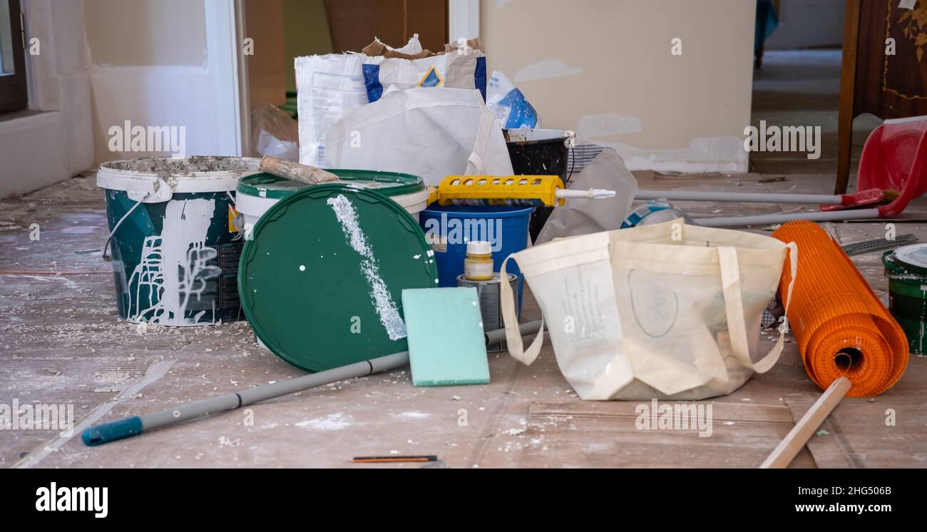 house renovation with all the tools on the ground , construction site