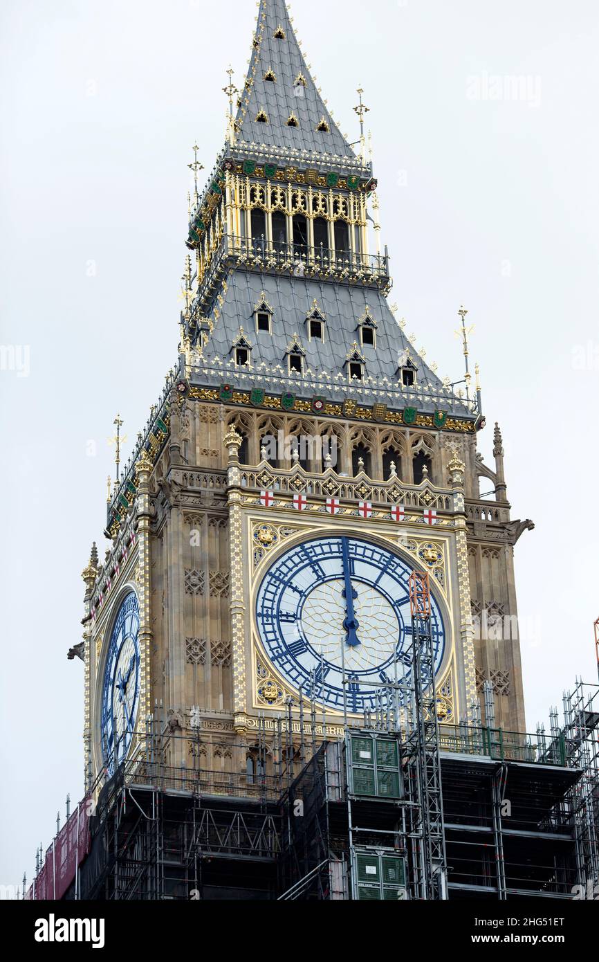 A clock face shows midday on Elizabeth Tower or Big Ben in Westminster, central London, on News Year’s Eve. Stock Photo