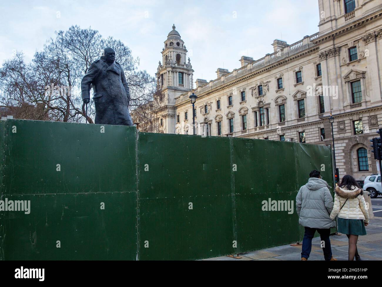 The statue of former Prime Minister Winston Churchill is seen boarded up in Parliament Square, London, on News Year's Eve. Stock Photo