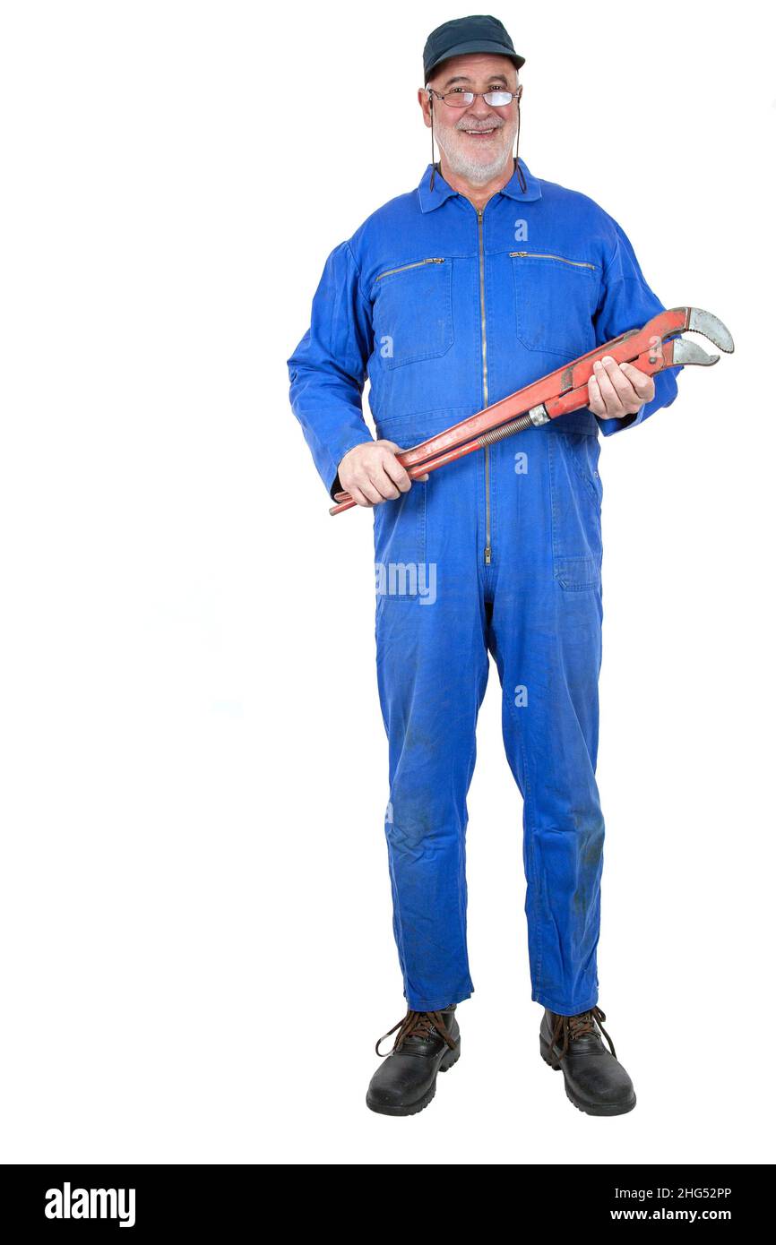 Smiling senior craftsman with his big red pipe wrench and great work experience, Stock Photo