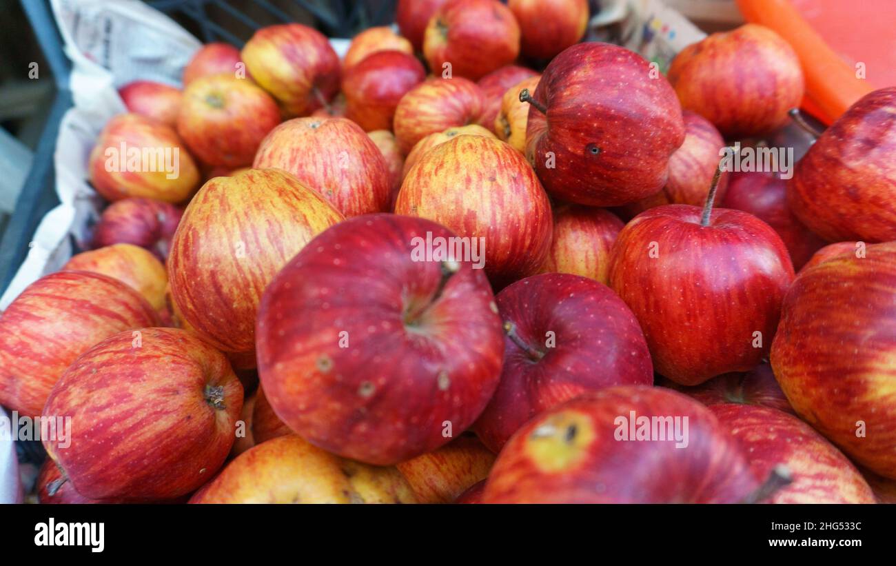 Red apples on village bazaar bench, organic red apples close up