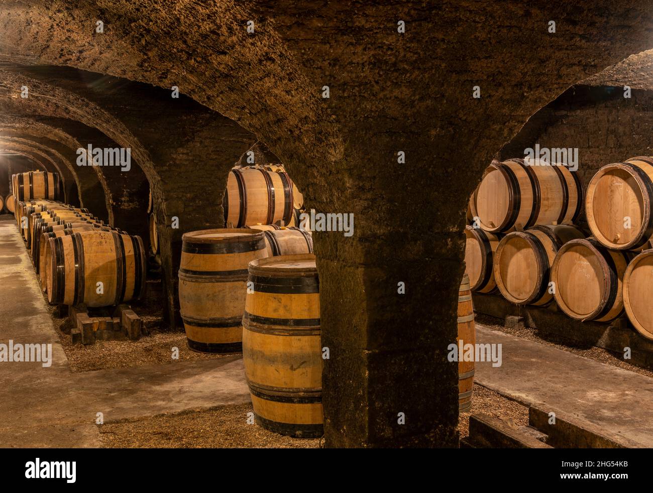 Meursault, France - July 2, 2020: Wine barrels in the cellar of the domaine Ropiteau Freres, Meursault, burgundy, France. Stock Photo