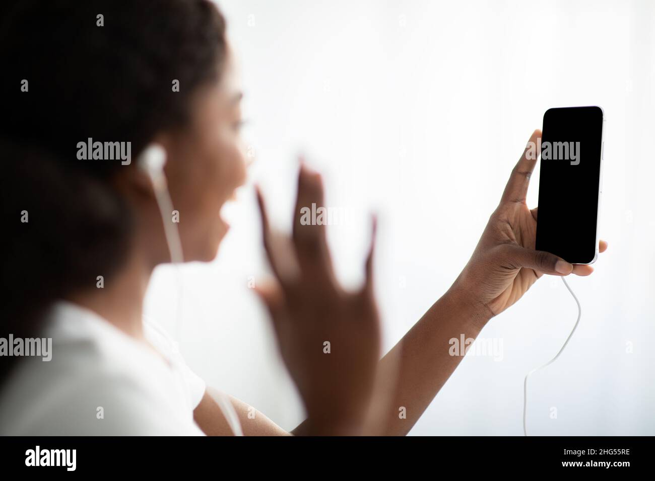 Positive black lady waving hi-res stock photography and images - Alamy